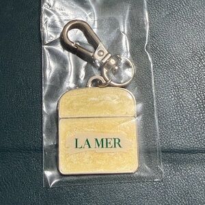La Mer Gold and Silver Keychain with Green Logo